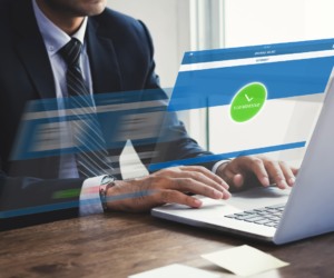 Client sitting at desk uses NatPay's reverse wire services